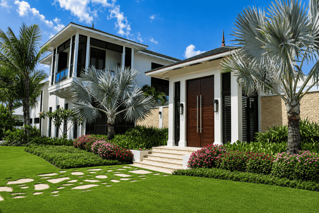 Elegant Bahamas villa with lush tropical landscaping and modern architecture.