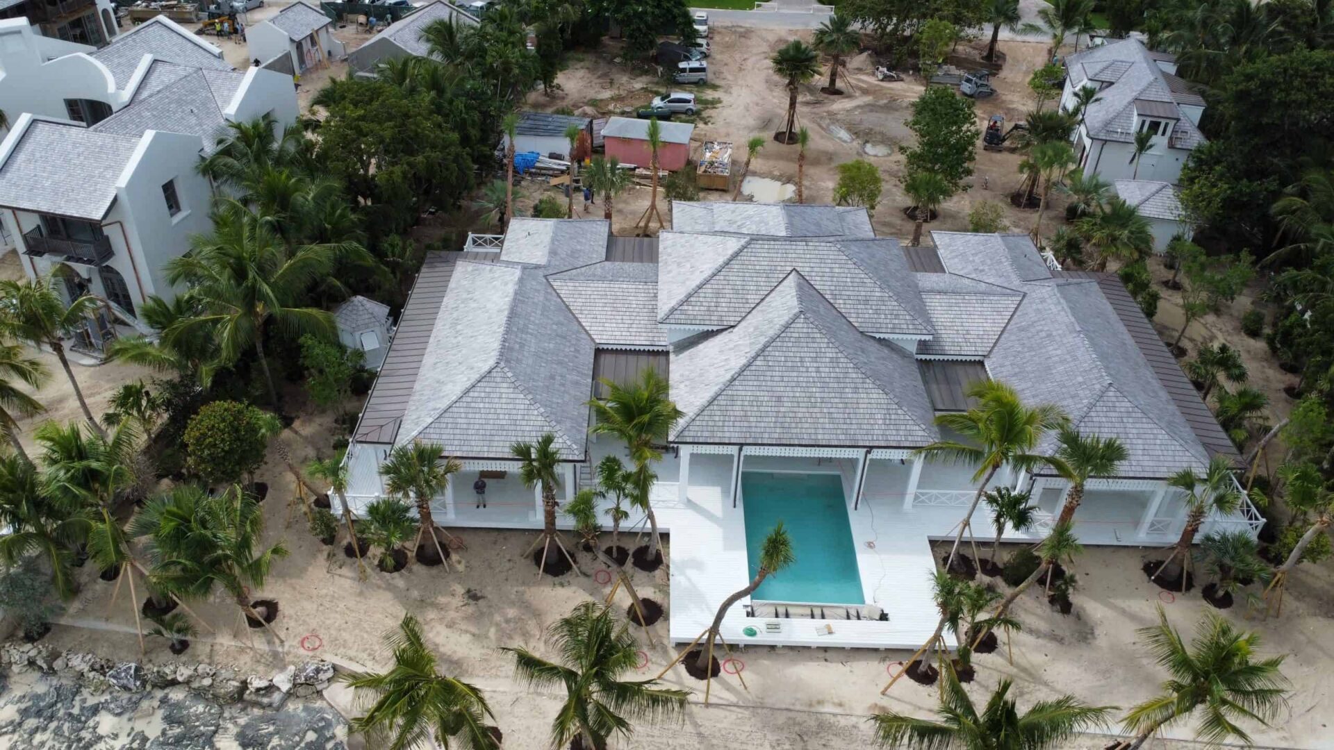 Aerial view of a luxury villa with a pool in the Bahamas.