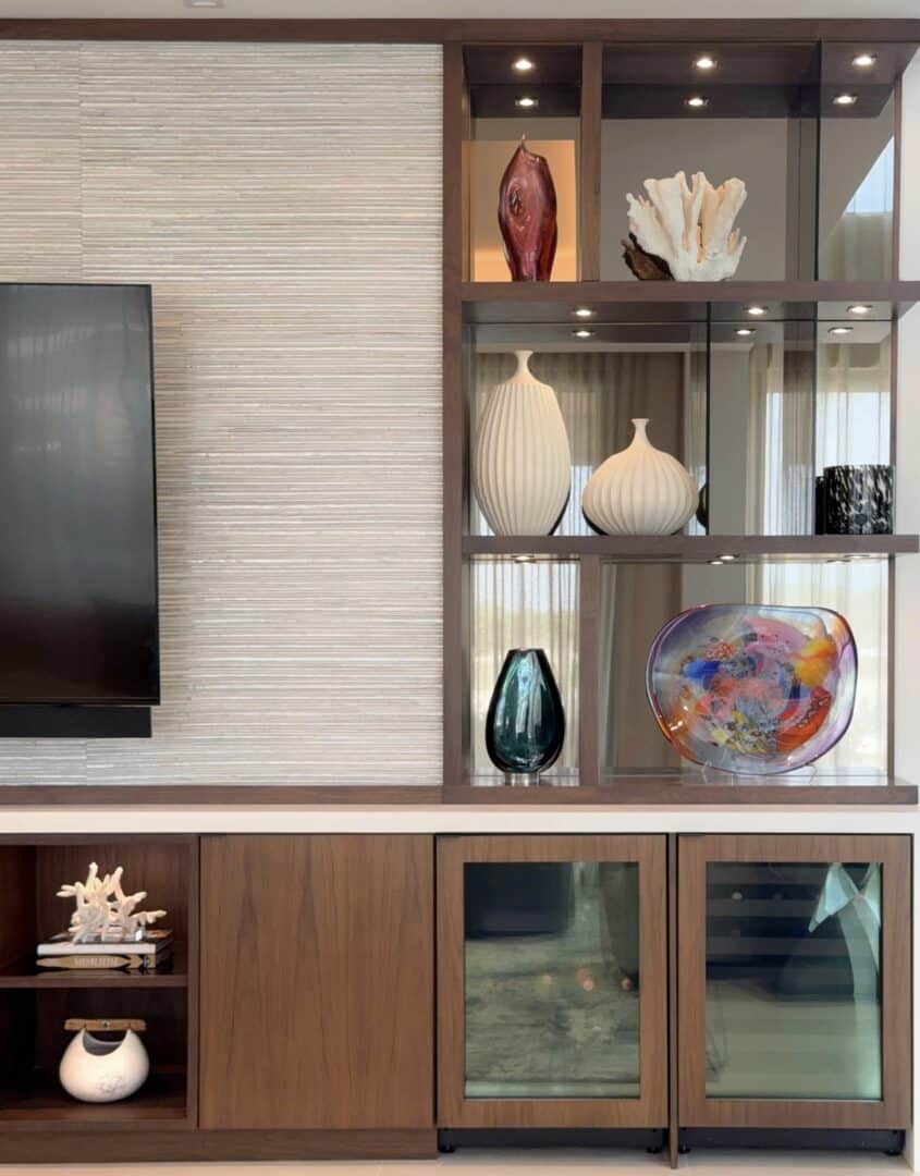 Elegant display of decorative vases and art pieces in modern interior.